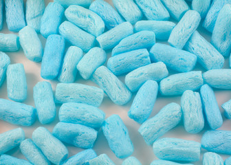 Close up of blue polystyrene foam pellet box filler for shipping fragile items to prevent damage and breakage
