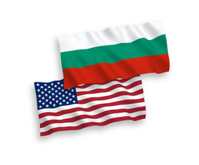 Fototapeta na wymiar National vector fabric wave flags of Bulgaria and America isolated on white background. 1 to 2 proportion.