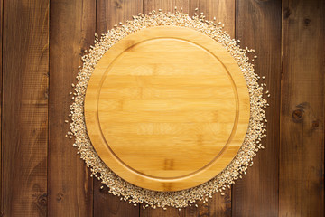 wheat grains on wooden background