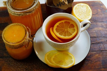 Hot tea with spices, honey and syrup - an alternative to antibiotics - selective focus