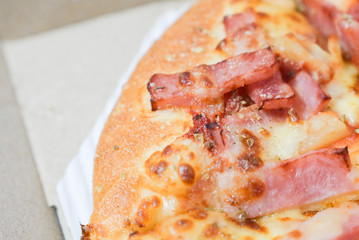 Close up of hawaiian pizza with boiled ham and pineapple.