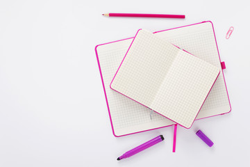 notebook and pencil at white background