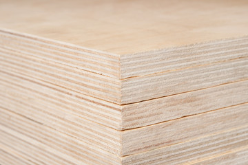 Plywood stacked in a pile.