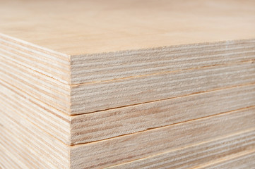 Plywood stacked in a pile.