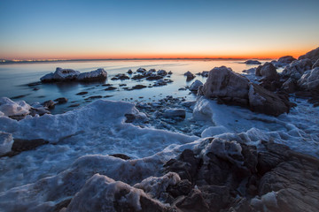 Sunrise by the sea in winter