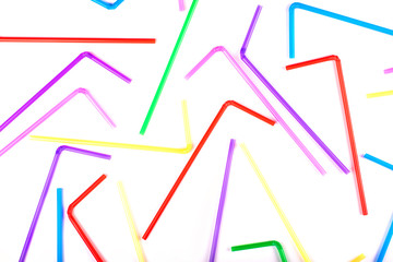 colored straws on a white background