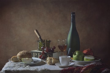 Still life of the table with fruits, Glass and a bottle of conag