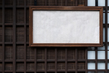 old style Japanese wooden wall and mat behide with a old style box of white paper sign label. copy space ready