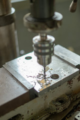 Drilling machine in factory workshop