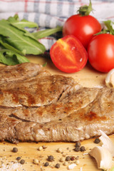 A beef steak well done with vegetables