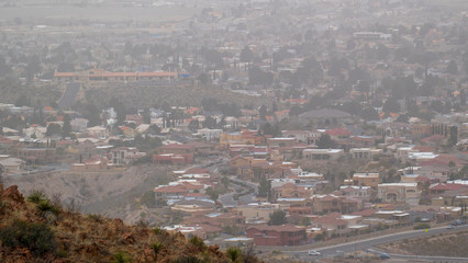 Small Town Rural Southwest City From Above Mountainside in a Hazy Day