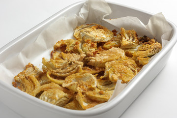 Baked fennel au gratin on white background
