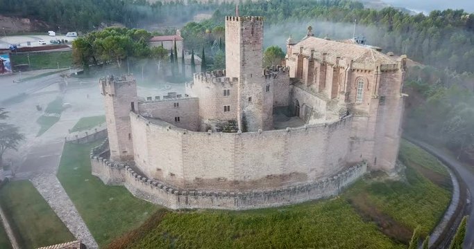   JAVIER, SPAIN - DECEMBER 3, 2018: Aerial view of impressive medieval castle of Xavier with attached Basilica on hill in town of Javier, Navarre, Spain