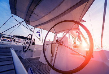A modern speed boat yacht steering wheels.