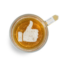 Sign Like, thumb up, on the beer foam in glass isolated on white background. Top view