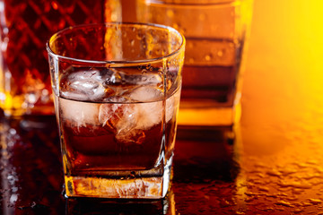 Glass of whiskey with natural ice.