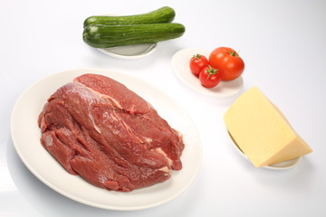 cheeseburger, chicken cutlet, bacon, tomatoes and slices of cheese, dressed with sauce and green salad for a restaurant menu on a white isolated background