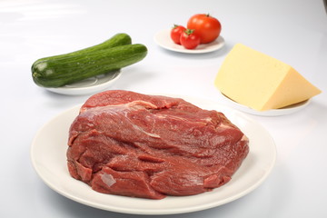 cheeseburger, chicken cutlet, bacon, tomatoes and slices of cheese, dressed with sauce and green salad for a restaurant menu on a white isolated background