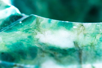 close up from one very decorative green marble ashtray