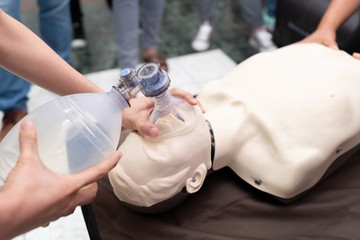 Nursing students are learning how to rescue the patients in emergency. CPR training with CPR doll and Am-bu bag for ventilation resuscitation.