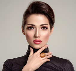 Beautiful young fashion woman with living coral lipstick. Attractive white girl wears luxury...