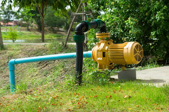 Electric water pumper at pond side.