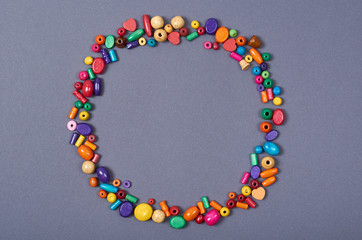 Wooden color beads composition. Needlework concept background. Flat lay