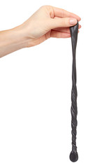 Teenager playing black slime with hand, transparent toy