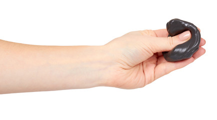 Obraz premium Teenager playing black slime with hand, transparent toy