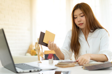 architecture, building, construction, real estate and property concept - close up of hands holding house  model.Home loan property ownership assurance concept