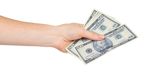 Hand with US dollars, concept of bribes and corruption.