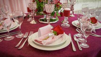 festive table decoration with red flowers