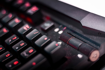 Advance new keyboard for extreme gamers. Black carbon casing, red and orange details. Nerd time concept, hardcore e-sports tools.  