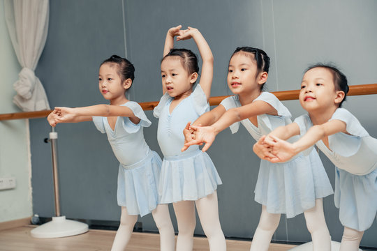Group of young Chinese kids studying at the ballet school