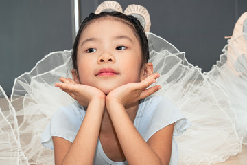 Chinese girl posing at the ballet school