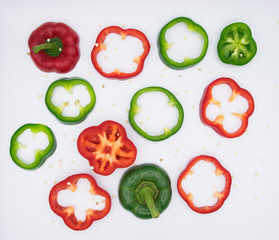 Set of sliced  red bell pepper section pieces isolated over white background, view above
