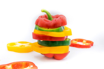 Set of sliced  red bell pepper section pieces isolated over white background, view above