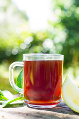 hot red tea cup with lemon