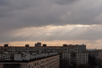 God rays (crepuscular rays) over the residential buildings