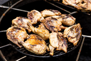 Chicken thighs on the natural volcanic stove grill