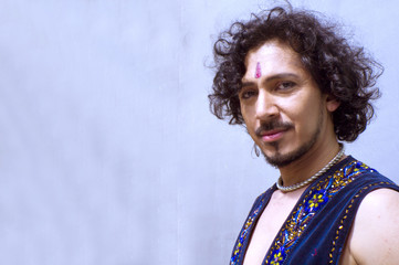 Bollywood dancer with beard and black curly hair