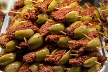 Close up, skewer of olives with garnish
