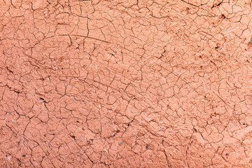 Clay earthen terracotta wall texture background  of traditional house of Morocco.