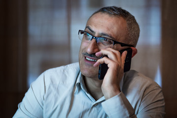 Handsome manager talking on the phone
