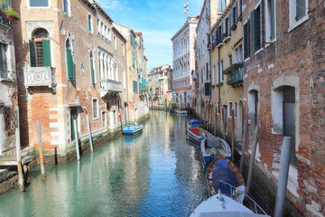 Fototapeta na wymiar boats on lateral narrow Canal