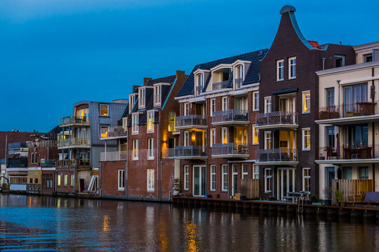beautiful dutch city architecture by night, luxurious houses with balconies, Alphen aan den Rijn, The Netherlands