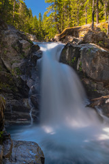 Fototapeta na wymiar The Ohanapecosh River cascades Silver Falls at Mount Rainier National Park