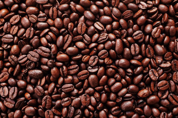 Rich brown roasted coffee beans background