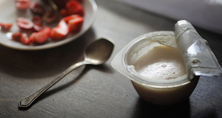 Fresh yogurt with berries. Ice cream in a bowl with fresh and juicy strawberries and cherries. Dessert with red berries.