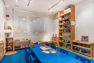 Playroom with a lot of object on table. Art room for education children's creativity. Preschool class waiting kids.